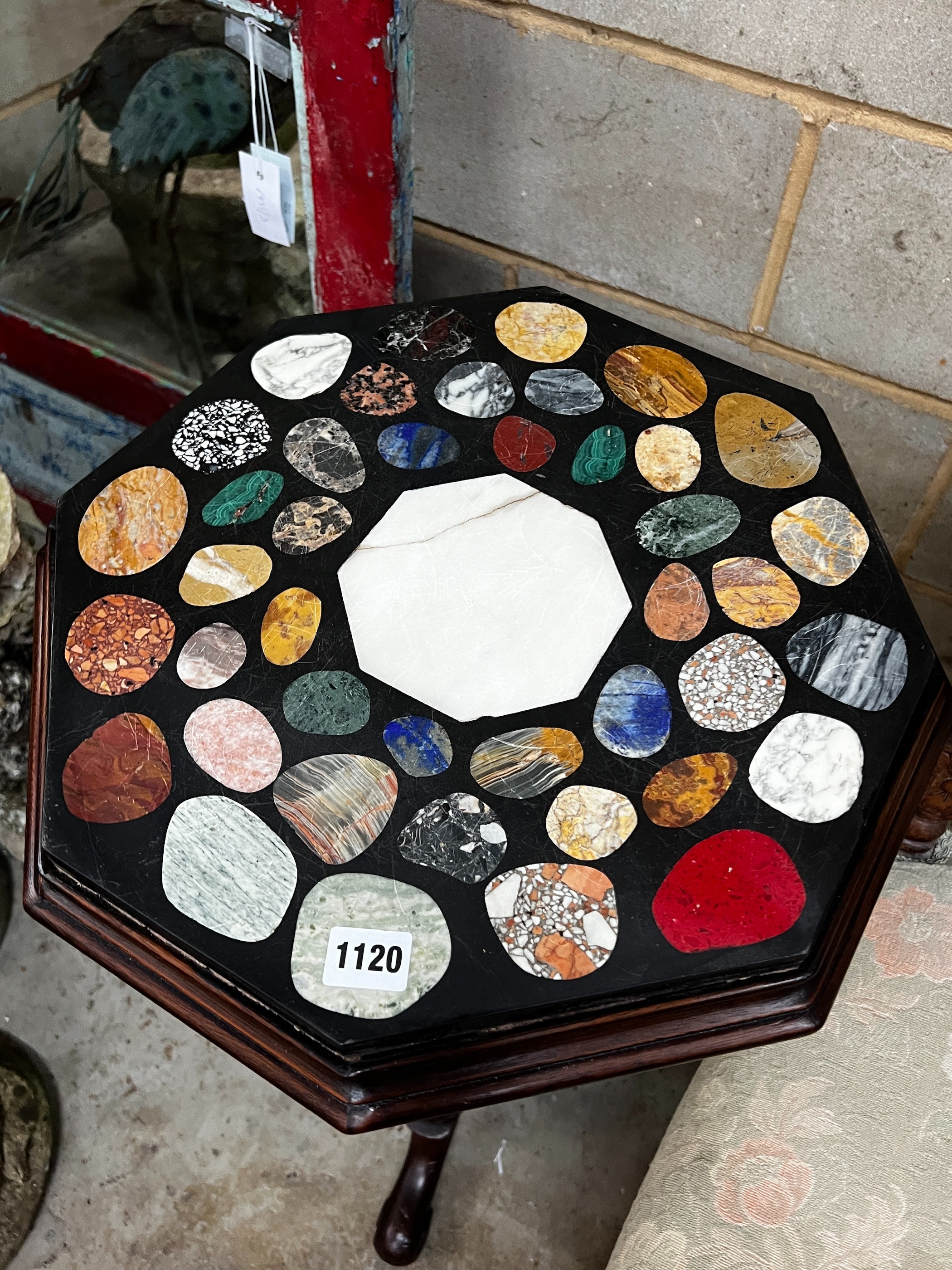 A Victorian style octagonal tripod table, width 42cm, height 76cm
